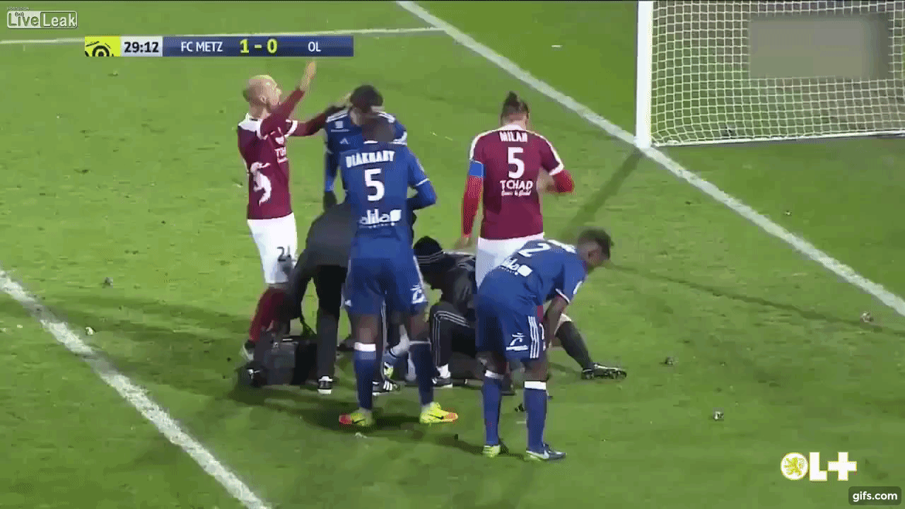 Goalkeeper hit by exploding FLARE during Soccer match animated gif