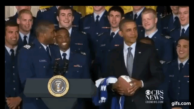 Obama striking the Heisman pose with the Air Force college football team.