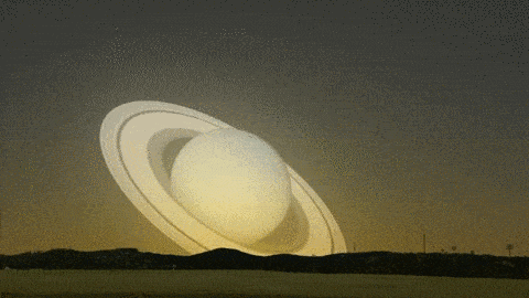 A visit from Saturn: What if Saturn flew past the Earth animated gif