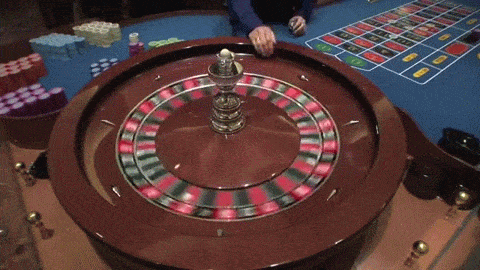 Roulette Wheel Spinning in Las Vegas Casino the Dealer Croupier Rims the  ball and Marks Winning Spot animated gif